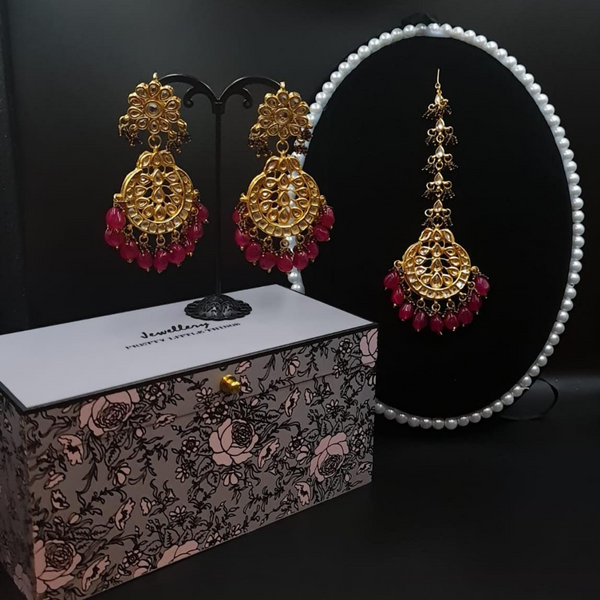 Bridal kundan piece is four layered set with dangling emeralds to match your festive.